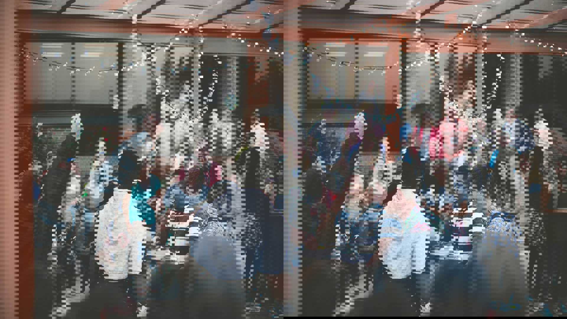 A group of people standing around each other